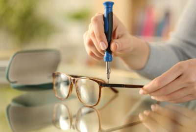 Close,Up,Of,Woman,Hands,Tightening,Screw,On,Glasses,With